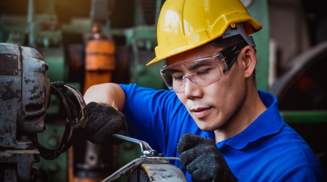 Man working with safety goggles on